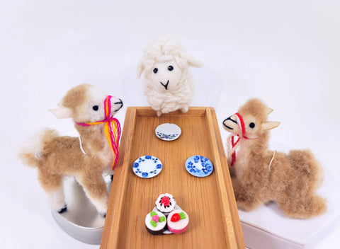 Mini Floral Plates pictured with three of our Miniature Sweet Shop treats (108623), our Small Stuffed Alpaca Vicunas (105573, sitting and standing versions), and one of our Small Felt Sheep (108430).